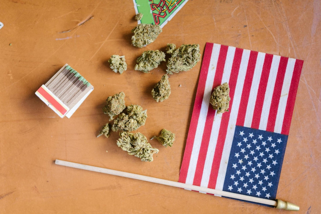 Cannabis dabs on a table next to a small american flag