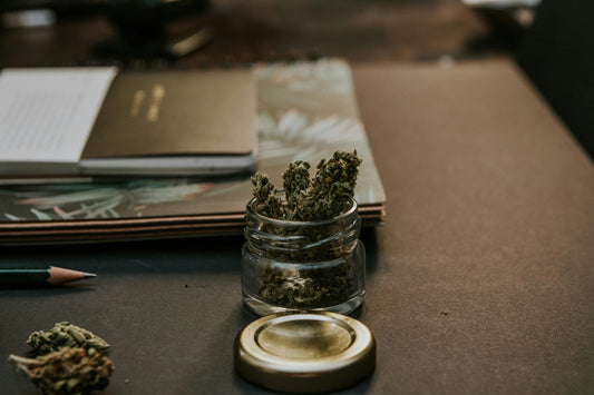 A jar of weed with stationery
