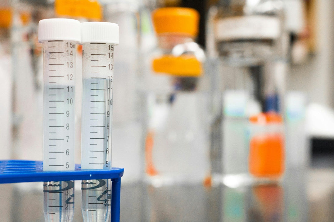 Two laboratory test tubes filled with liquid