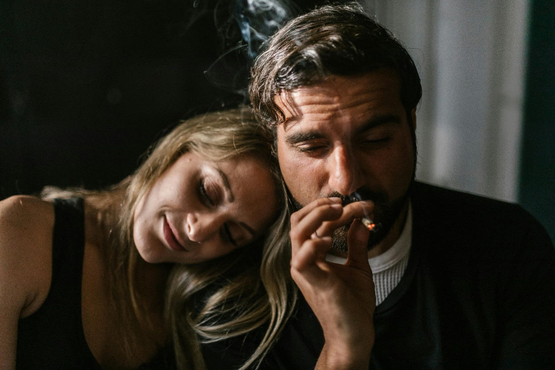 A man and a woman smoking weed