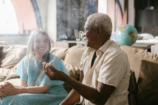 Man and a woman smoking weed and laughing