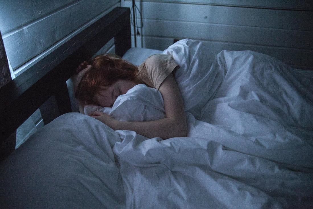 A woman sleeping in bed