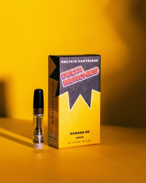 Delta Munchies Delta 8 Banana OG Cart product box on a yellow background