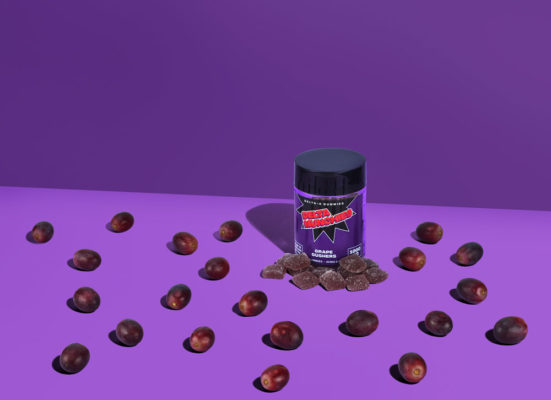 Delta 8 gummies delta munchies grape gushers on a purple background