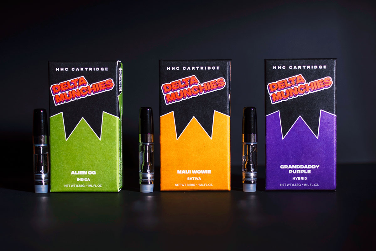 Delta Munchies' HHC vape cartridges and their boxes next to each other.
