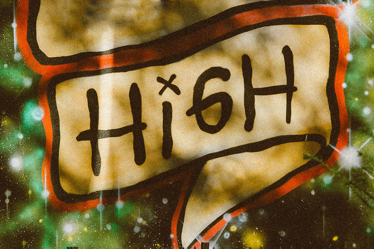 Close up shot of a sign that reads "High."