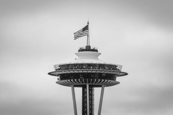 Black and white image of the top of the Seattle Tower.