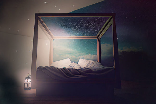 Bed with a wooden frame with a starry night background.