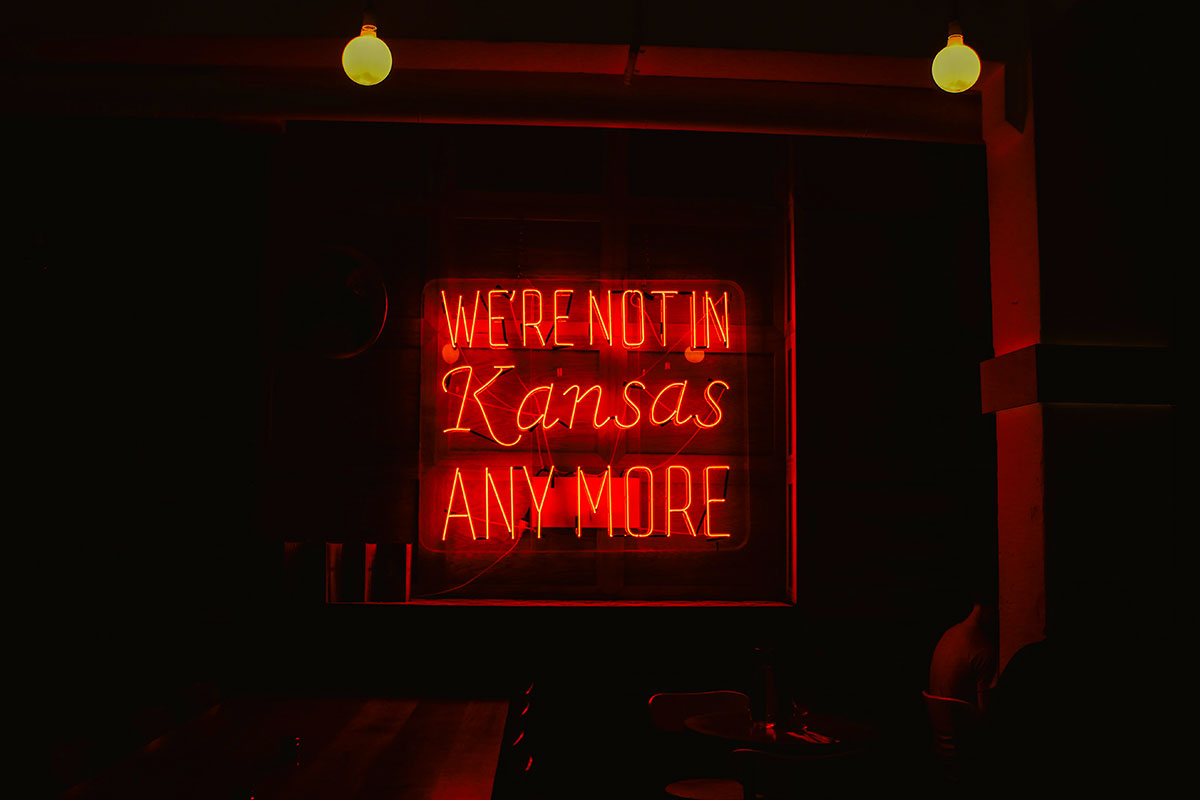 Red neon sign that reads "We're not in Kansas anymore."