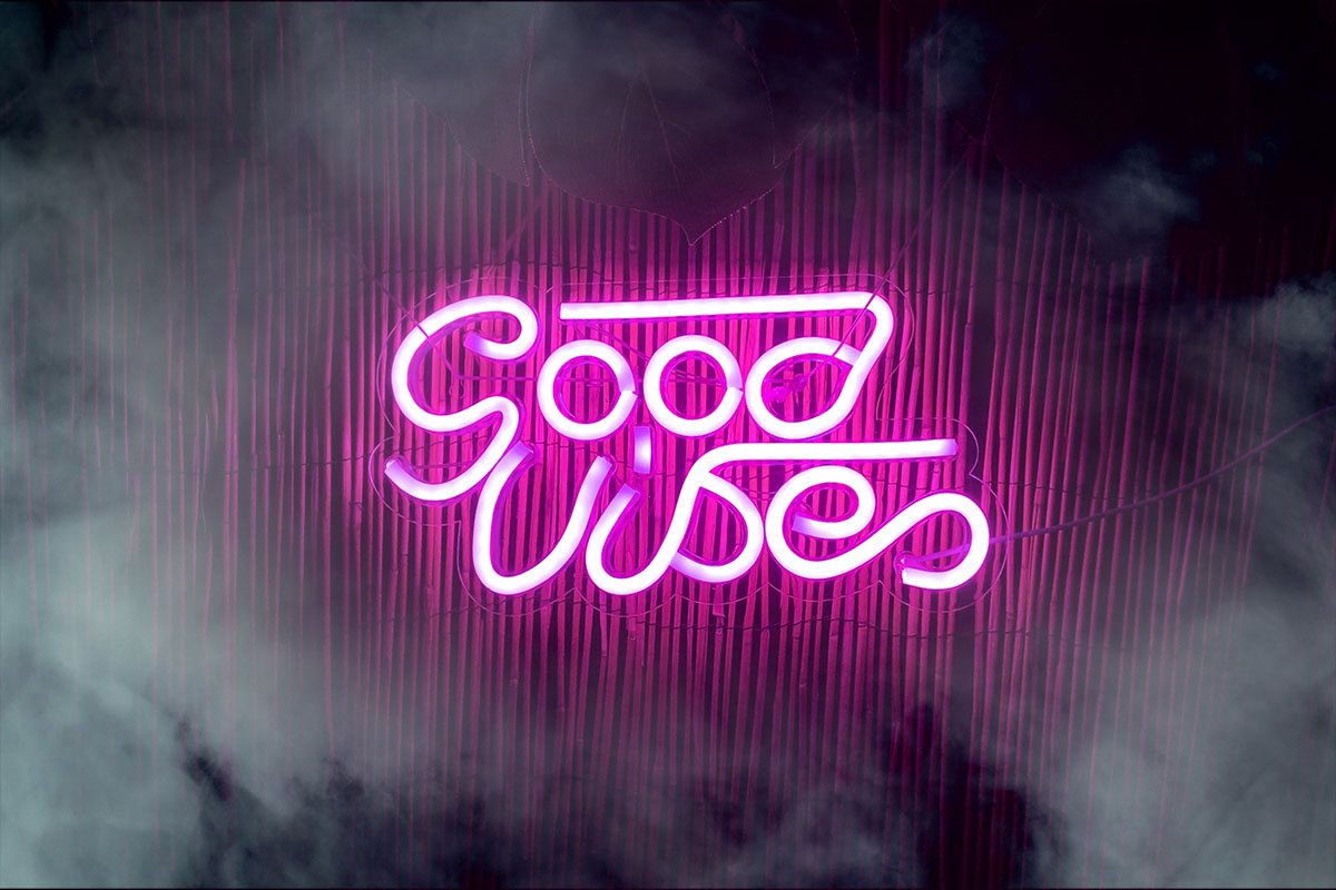 Pink neon sign that reads "Good Vibes."