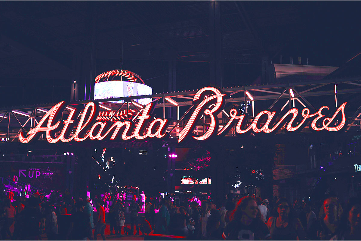 Night party at Atlanta Braves Truist Park in Georgia, with a lively crowd of people enjoying the festivities
