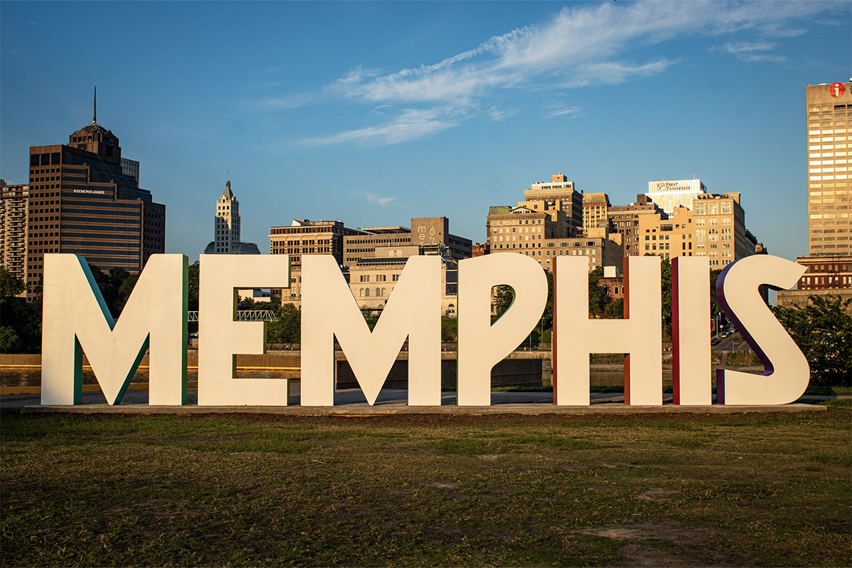 Memphis sign at Mud Island Park by the river with buildings in the background in the city of Tennessee